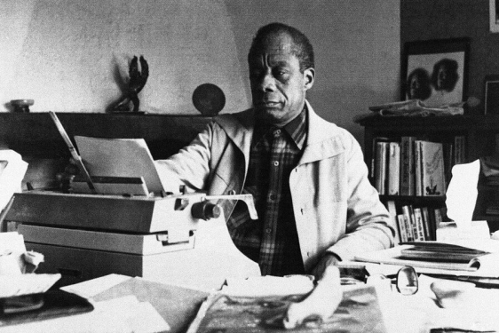 b/w photo of man with typewriter