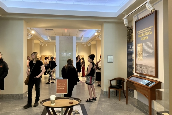 photo of people and exhibits in gallery