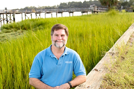 man in marsh, photo