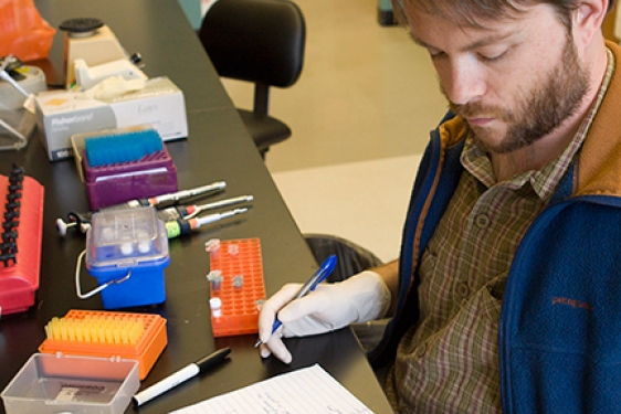 man in lab with gloves