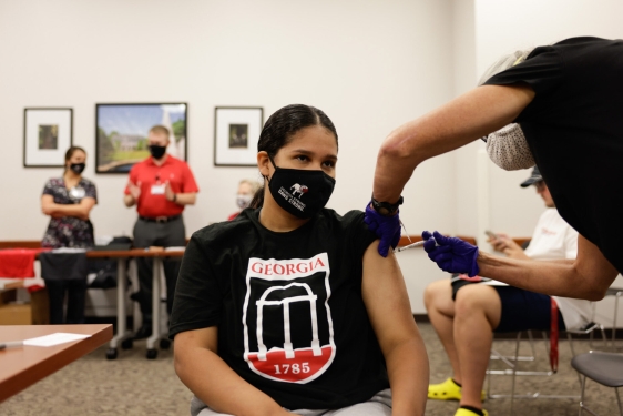 photo of woman getting vaccinated