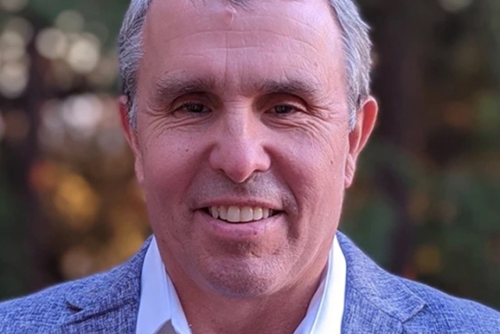 headshot of man, outdoors