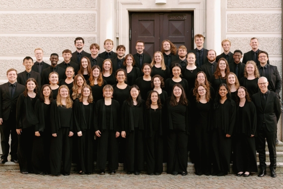 group photo of people, in black suits and gowns