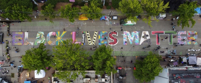 aerial photo of street with Black Lives Matter written on pavement