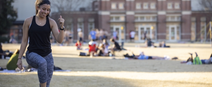 photo of student quad, with woman in foreground