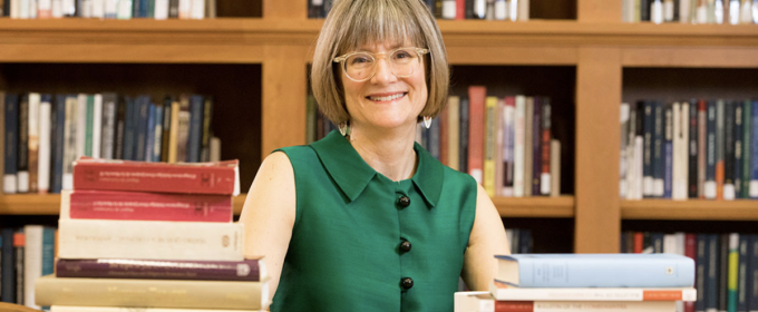 photo of woman with books