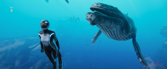 still image from undersea video game, with diver and whale