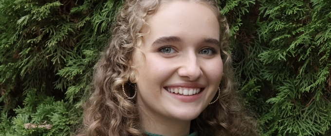 photo of woman, green foliage in background