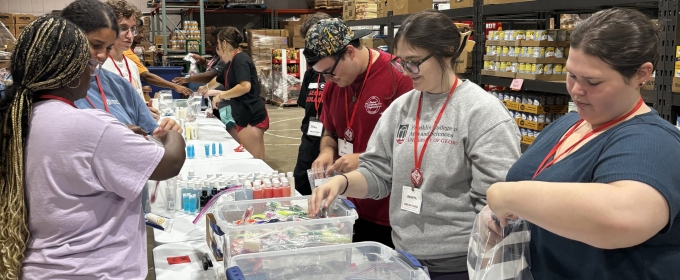 photo of people packing supplies in warehouse