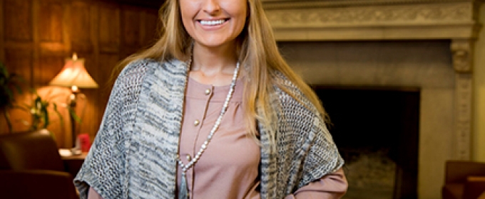 photo of woman with hearth in background