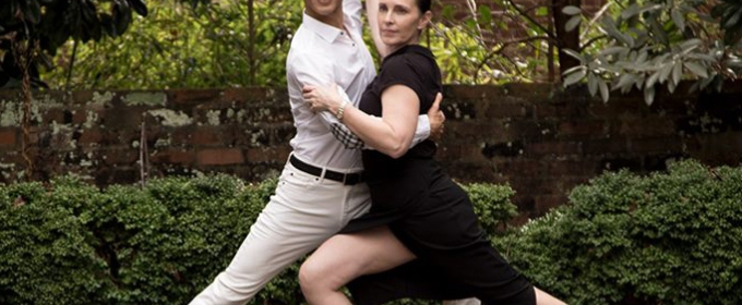 photo of two people in a dance pose, garden backdrop