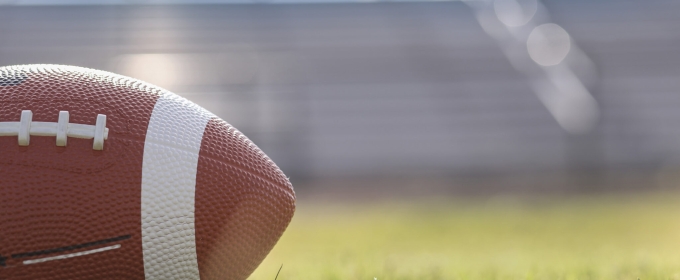 stock photo of football on grass field