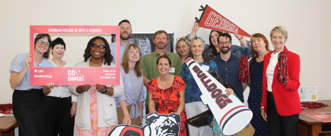 group photo of people holding banners with brnding