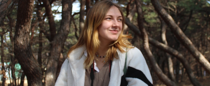 photo of woman, trees in background