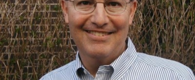 headshot photo of man, outdoors