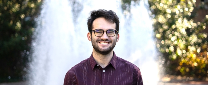 photo of man in front of fountain, day