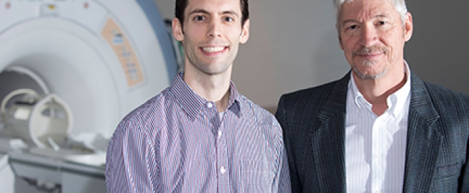 two men with fMRI machine 