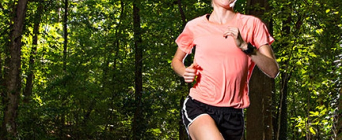 woman running in the woods