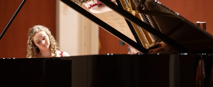 photo of woman playing piano