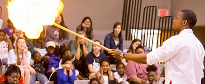 man, with students and fire demo