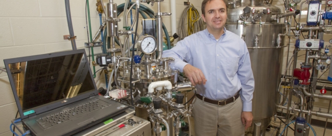 photo of man with fermentation equipment