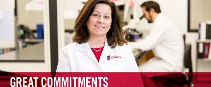 photo of woman with color graphic and man with microscope in background