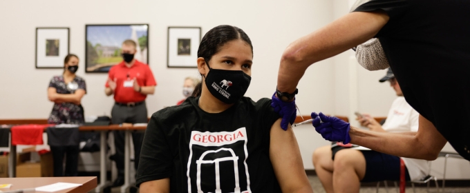 photo of woman getting vaccinated