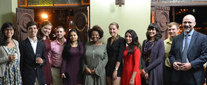 group photo in front of old large doors