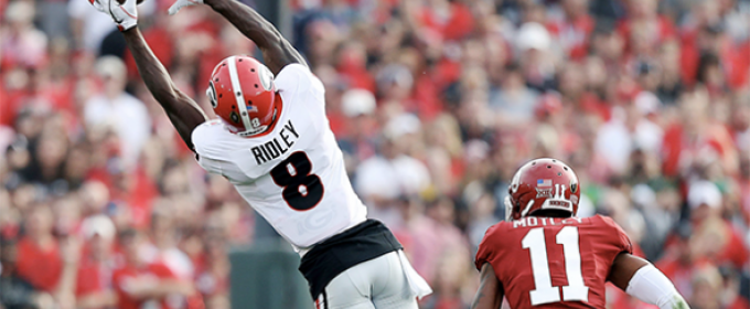 football player stretching for a catch