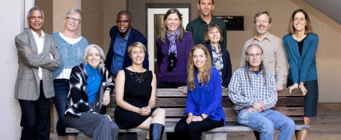 group photo of people outside daytime, four sitting, eight standing