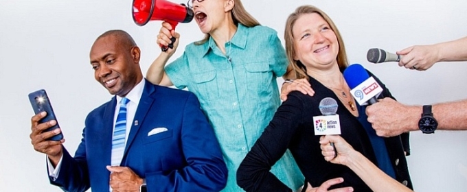 photo of man and two women, microphones, 