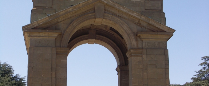 photo of arched monument with four pillars 