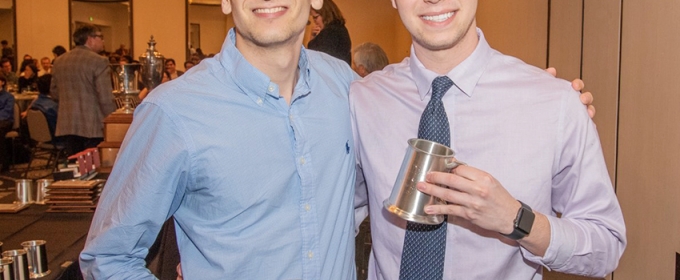 Photo of two men holding silver steins