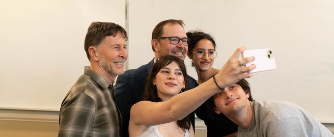 photo of five people taking a selfie