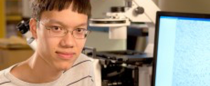 student with computer
