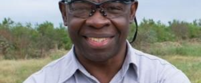 headshot photo of a man outdoors