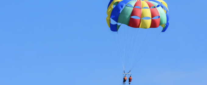photo of two people parasailing