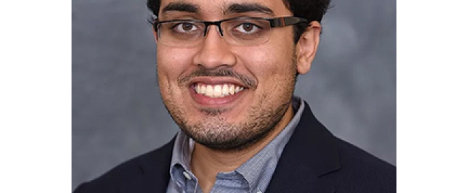 headshot of man with glasses