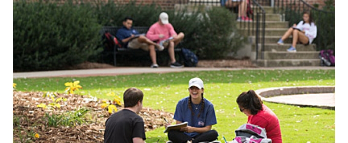 students on the lawn in front of old college