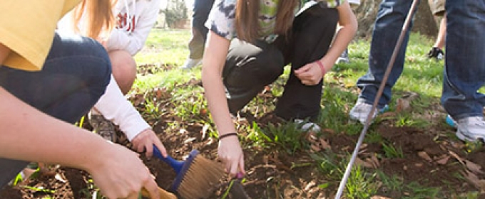 students outdoors on a dig