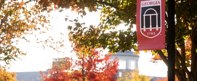 photo of foliage and banner with cupola