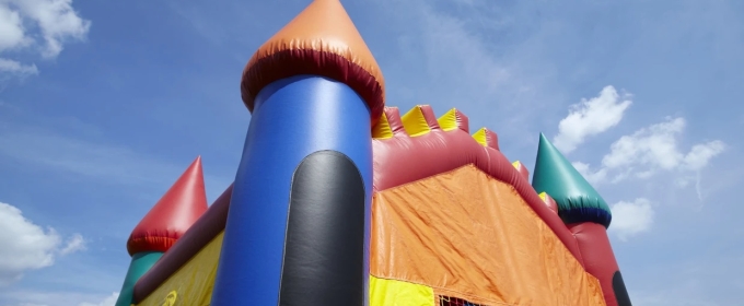 photo of bouncy castle, with blue sky