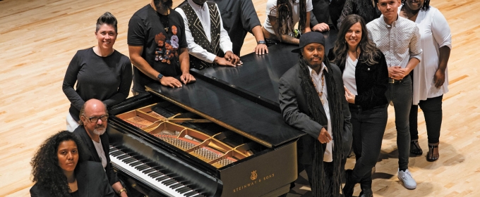 cover photo for magazine with 13 people standing around a grand piano on a concert stage