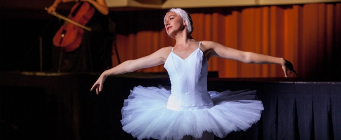 photo of ballerina, with cellist in the background