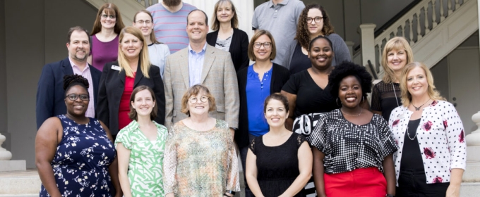 group photo on steps of the Hunter Holmes academic building