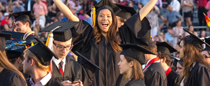 group of grads with women at center