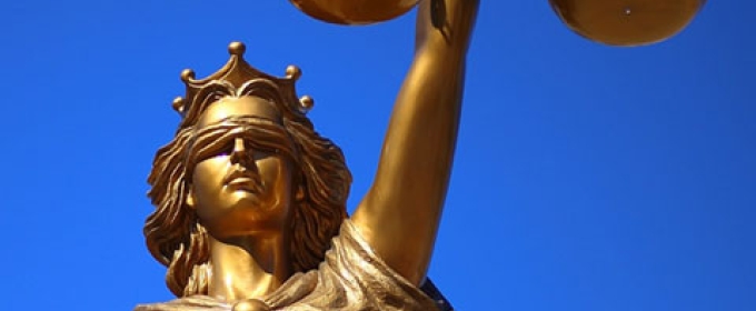 photo of statue of Lady Justice (Goddess), with blue sky