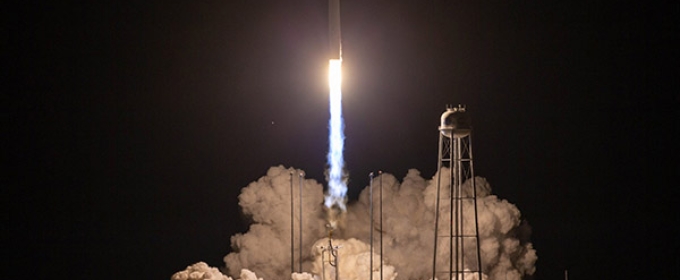 Photo of rocket launch at night