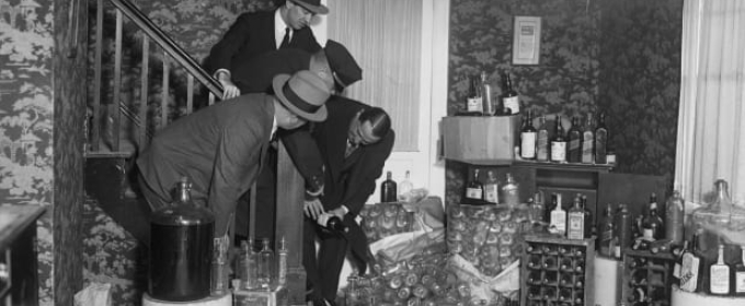 black and white archival image of alcohol hoarding