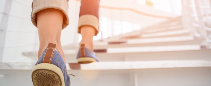 photo of shoes and legs on stairs